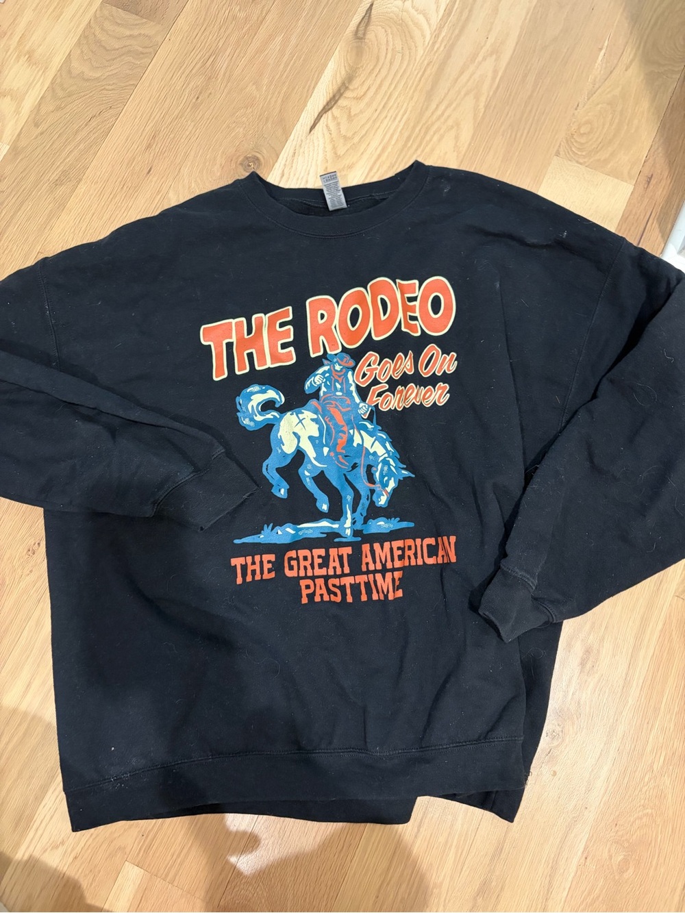 Gildan Black Crewneck Sweatshirt with Orange and Blue Rodeo Graphic